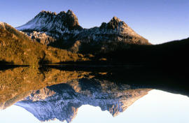 Reflection of mountain on still surface of Dove Lake