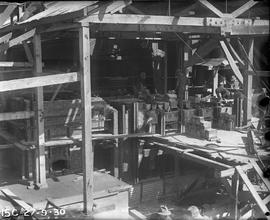 Bricklayers building furnace at E.Z. Co. Zinc Works