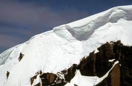 Snow climbers near mountain ridge