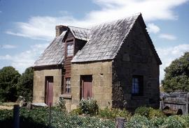 Stone cottage with shingle roof