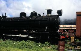 Locomotive steam engine in railyard