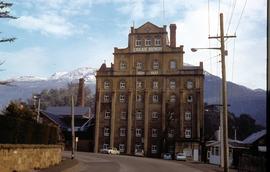 Cascade Brewery building in front of snow-capped mountain