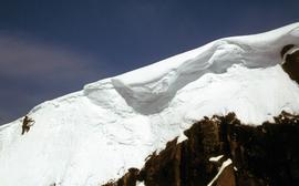 Snow climber nears a ridge