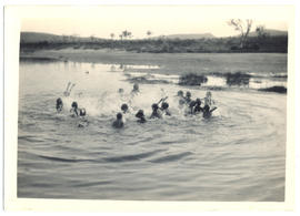 Photograph of aboriginal children swimming in a waterhole